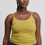 woman wearing a yellow fitted cotton cashmere strap top with a round neckline.