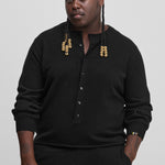 man wearing a black cashmere sweater with corozo buttons.
