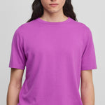 man wearing a bright pink short-sleeved cotton cashmere crewneck t-shirt.