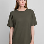 woman wearing an army green short-sleeved cotton cashmere crewneck t-shirt.