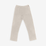 white cashmere pants with straight legs, drawstring waist and side pockets, laid flat.