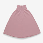 pink cashmere skirt with rib-knitted waistband and rolling edge hem, laid flat.